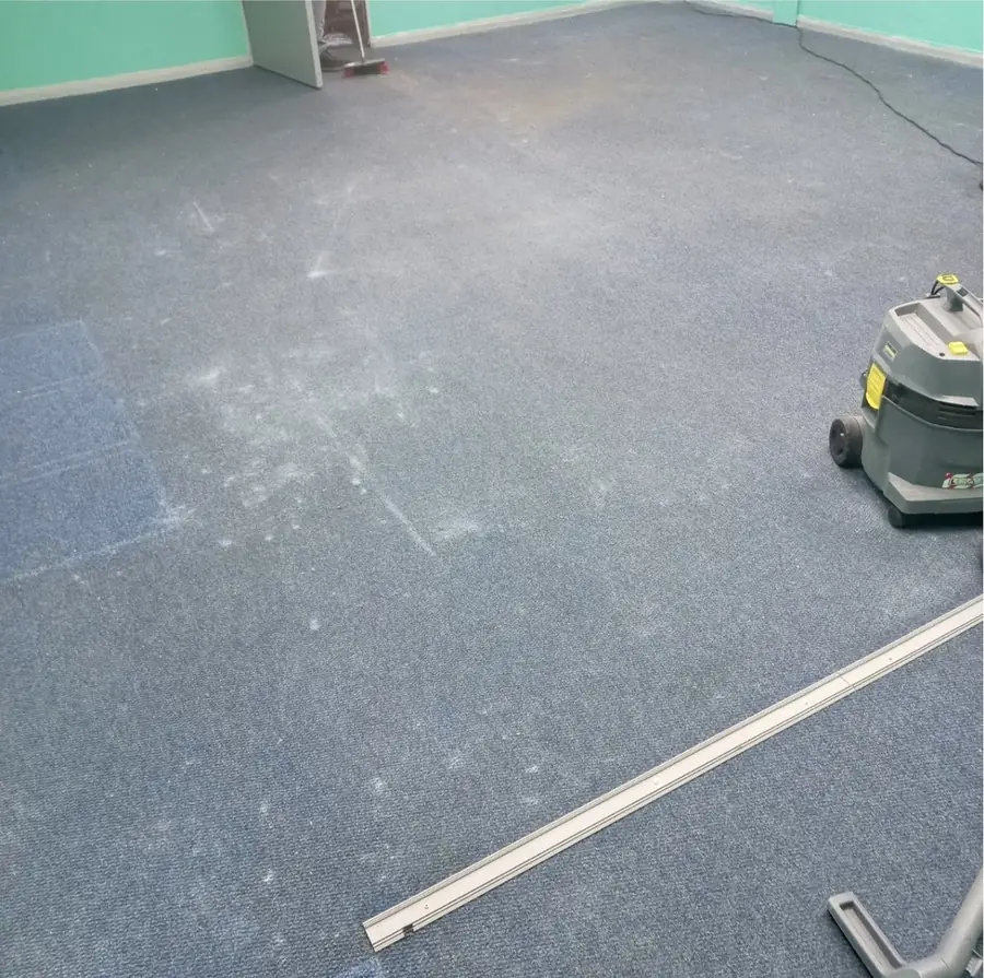 Office carpet before cleaning, patchy and dust-marked