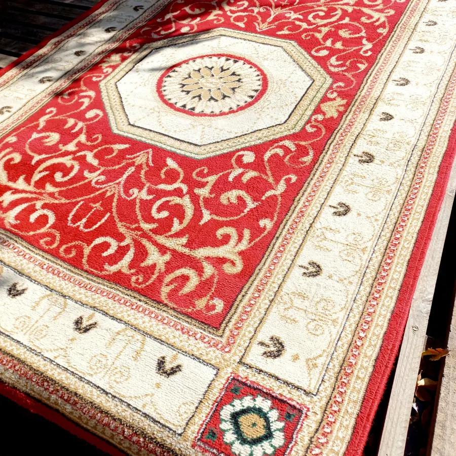 Persian-style rug after professional cleaning, colours restored and bright